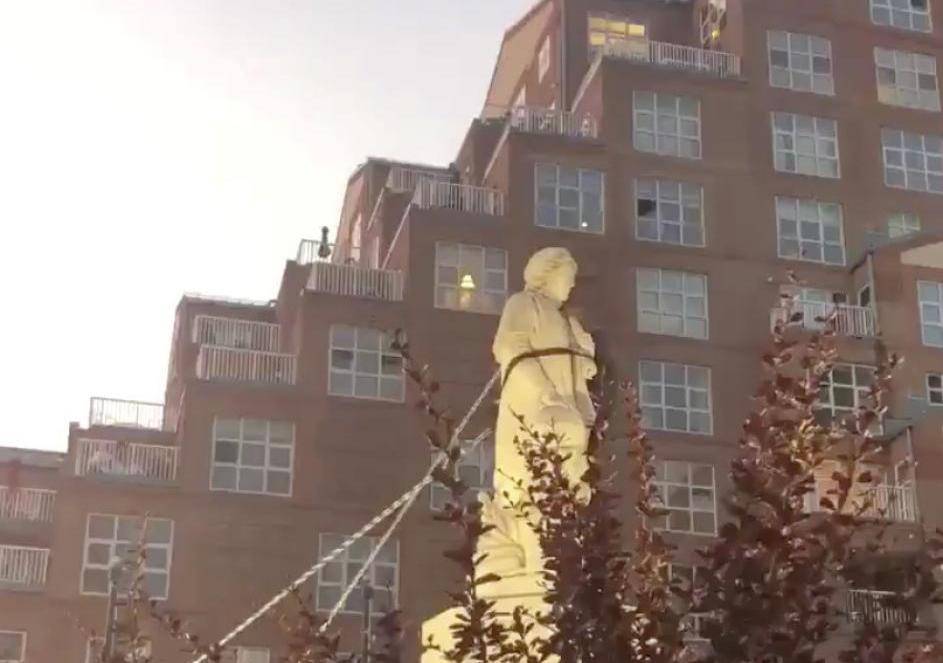 Protesters pull down the statue of Christopher Columbus in Baltimore