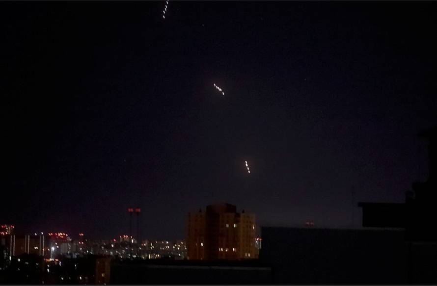 Russian missiles which appear to be the Oreshnik hypersonic ballistic missile, fly during a Russian missile and drone strike in Kyiv