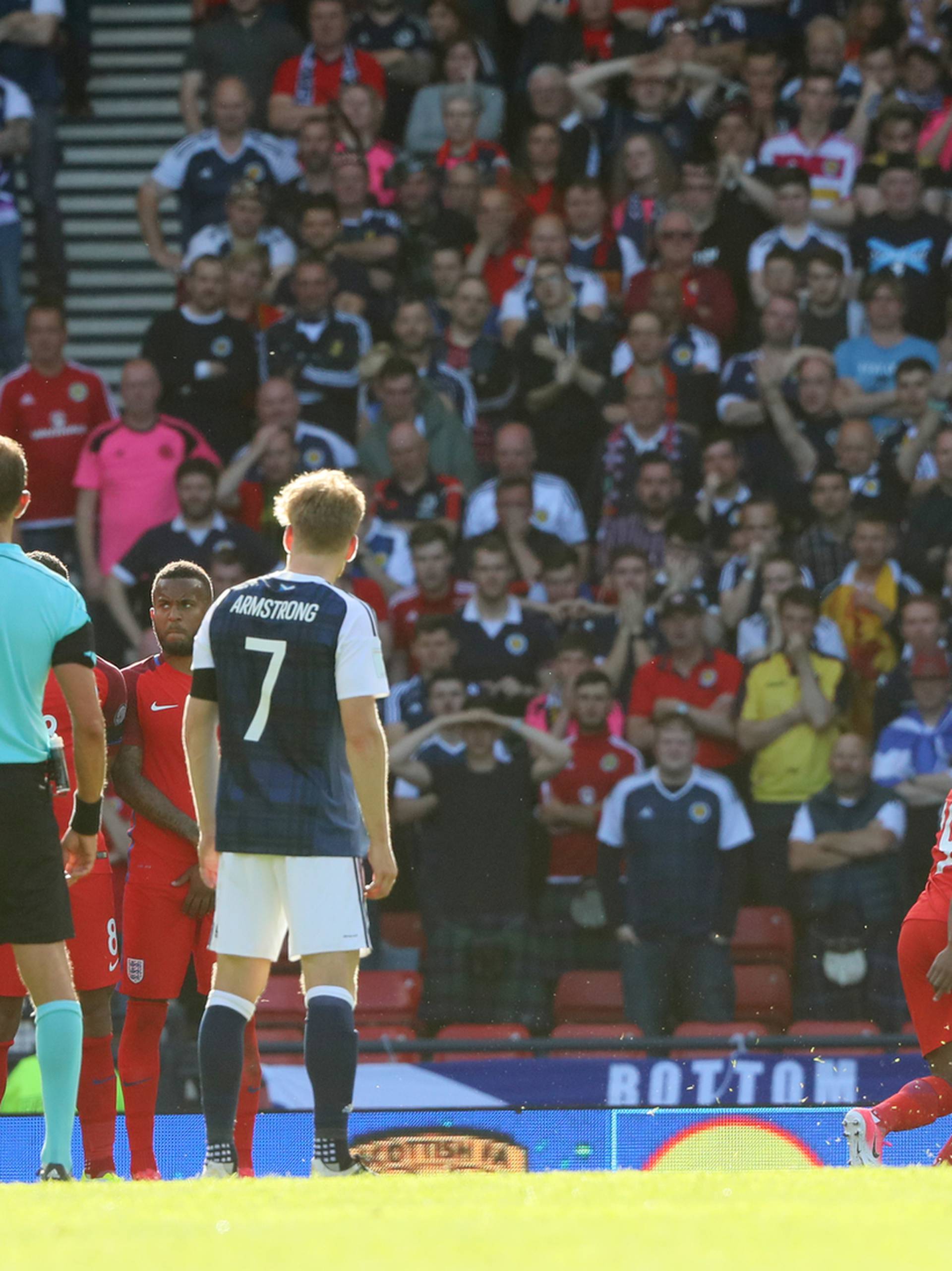 Scotland's Leigh Griffiths scores their first goal from a free kick