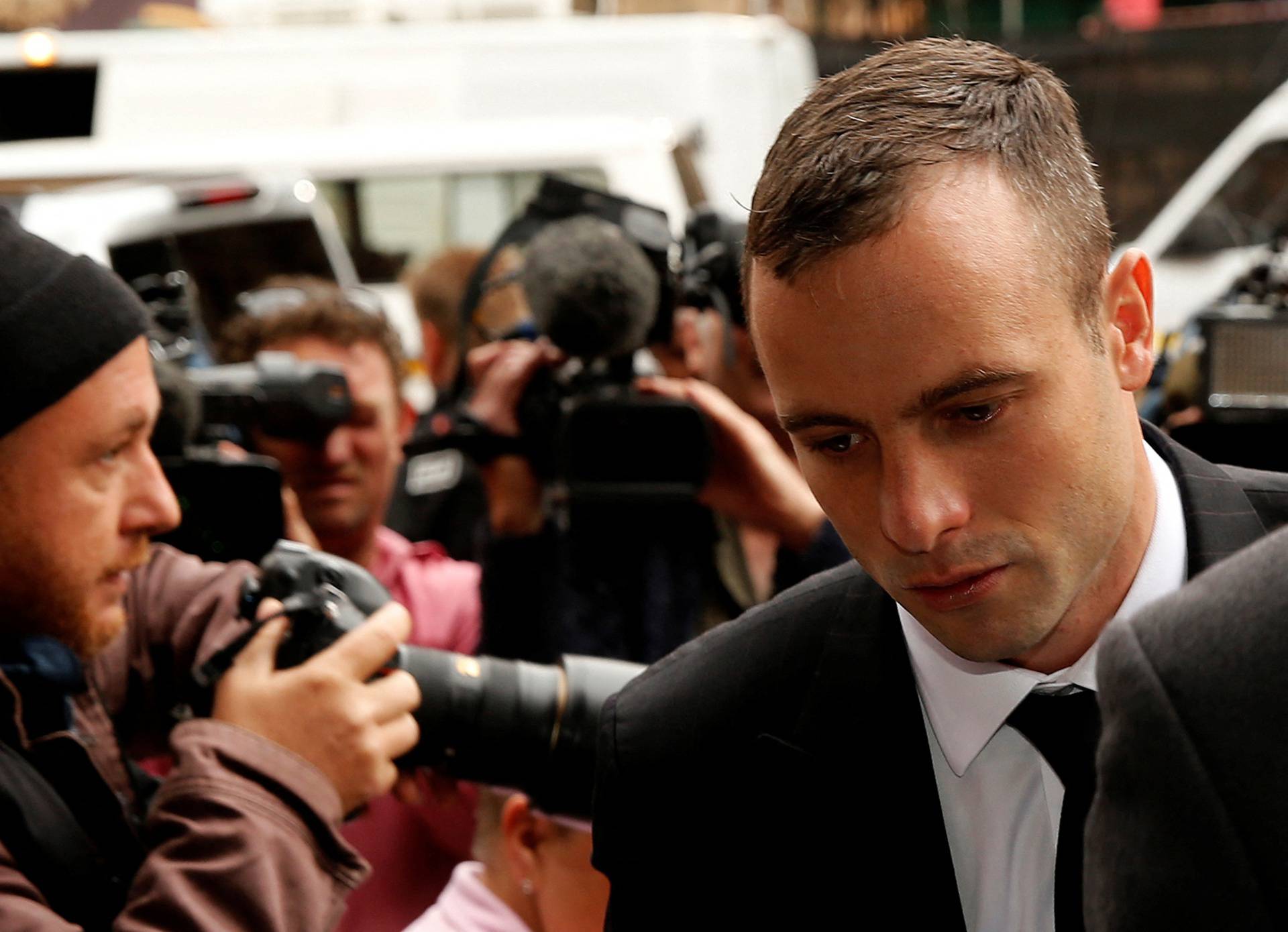 FILE PHOTO: Olympic and Paralympic track star Pistorius arrives ahead of his trial for the murder of his girlfriend Steenkamp, at the North Gauteng High Court in Pretoria