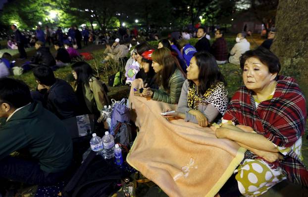 Evacuated residents gather at Shirakawa park after an earthquake in Kumamoto, southern Japan