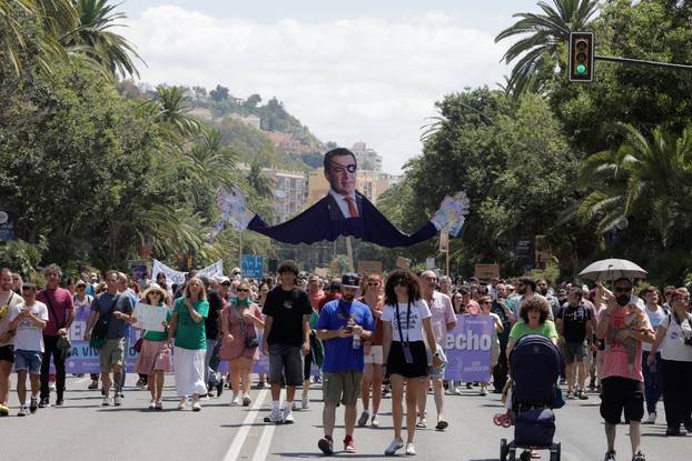 People demonstrate against mass tourism in Malaga