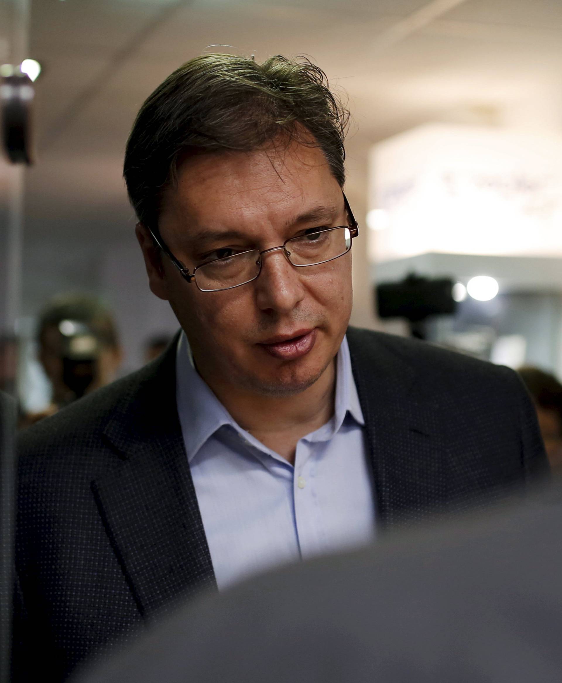 Prime Minister and leader of the Serbian Progressive Party Vucic arrives to cast his ballot in Belgrade