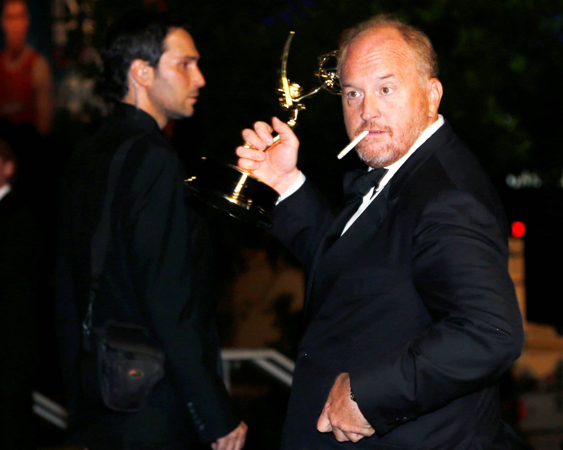 FILE PHOTO: Louis C.K. with his Outstanding Writing for a Comedy Series for FX Networks "Louie" arrives at the Governors Ball for the 66th Primetime Emmy Awards in Los Angeles