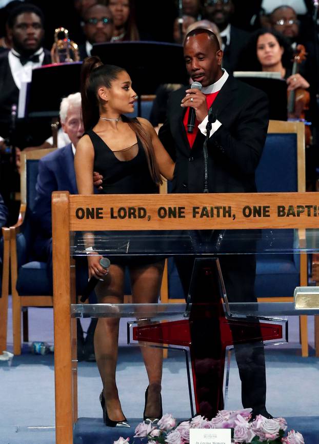 Pastor Charles speaks with singer Ariana Grande after she performed at the funeral service for Aretha Franklin at the Greater Grace Temple in Detroit