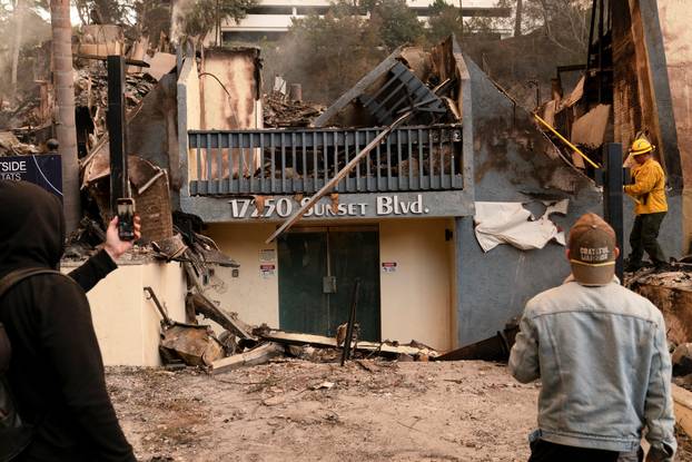 The remains of homes following the Palisades Fire in the Pacific Palisades neighborhood in Los Angeles