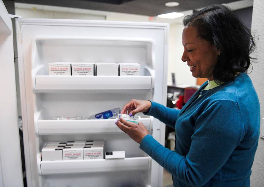 Ana Montanez holds MMR vaccines in Lubbock, Texas