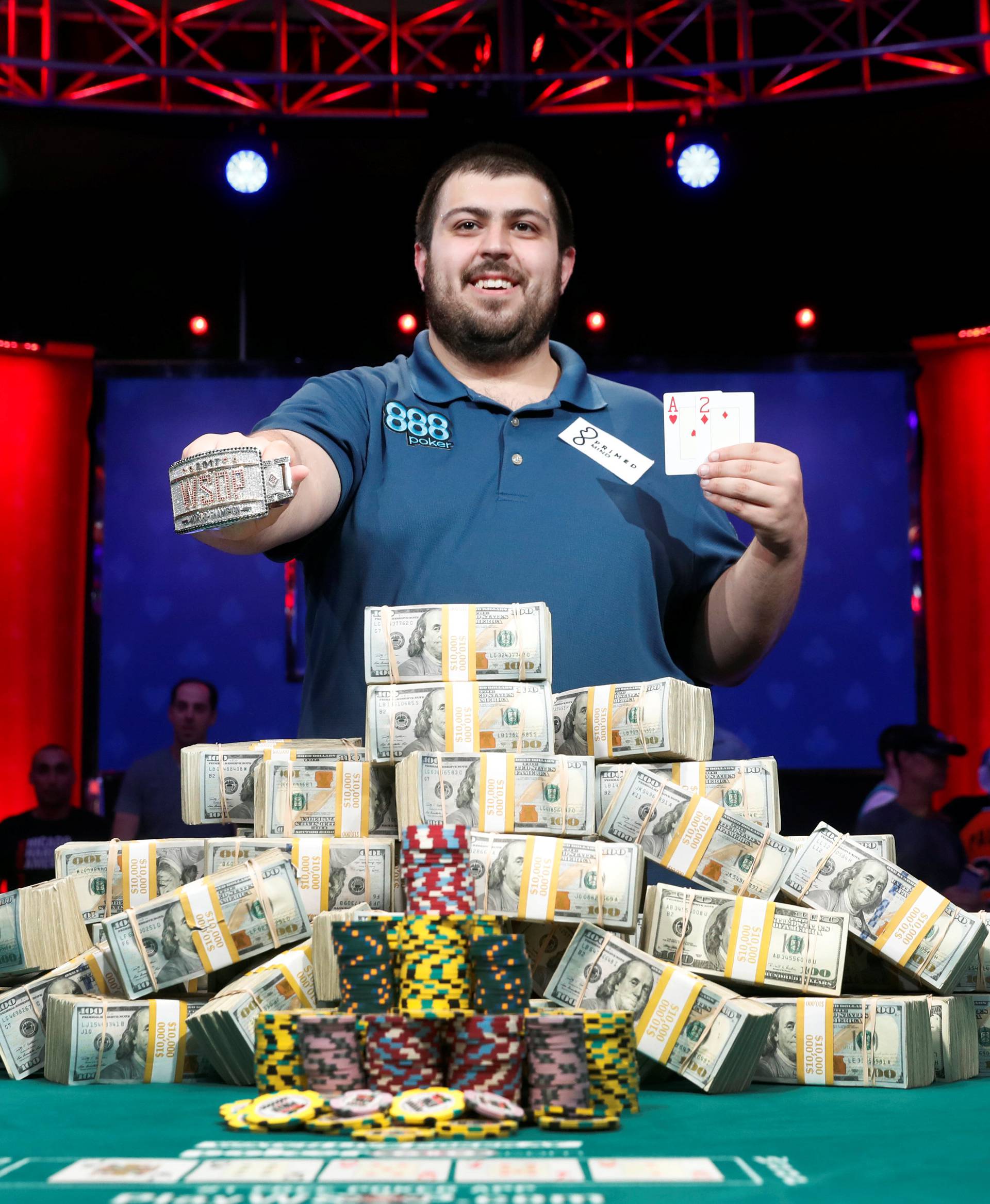 Scott Blumstein of the U.S. poses with his championship bracelet and cards after winning the World Series of Poker Main Event in Las Vegas