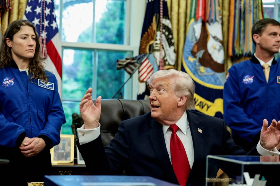 FILE PHOTO: U.S. President Donald Trump meets Artemis II astronauts in the Oval Office at the White House in Washington