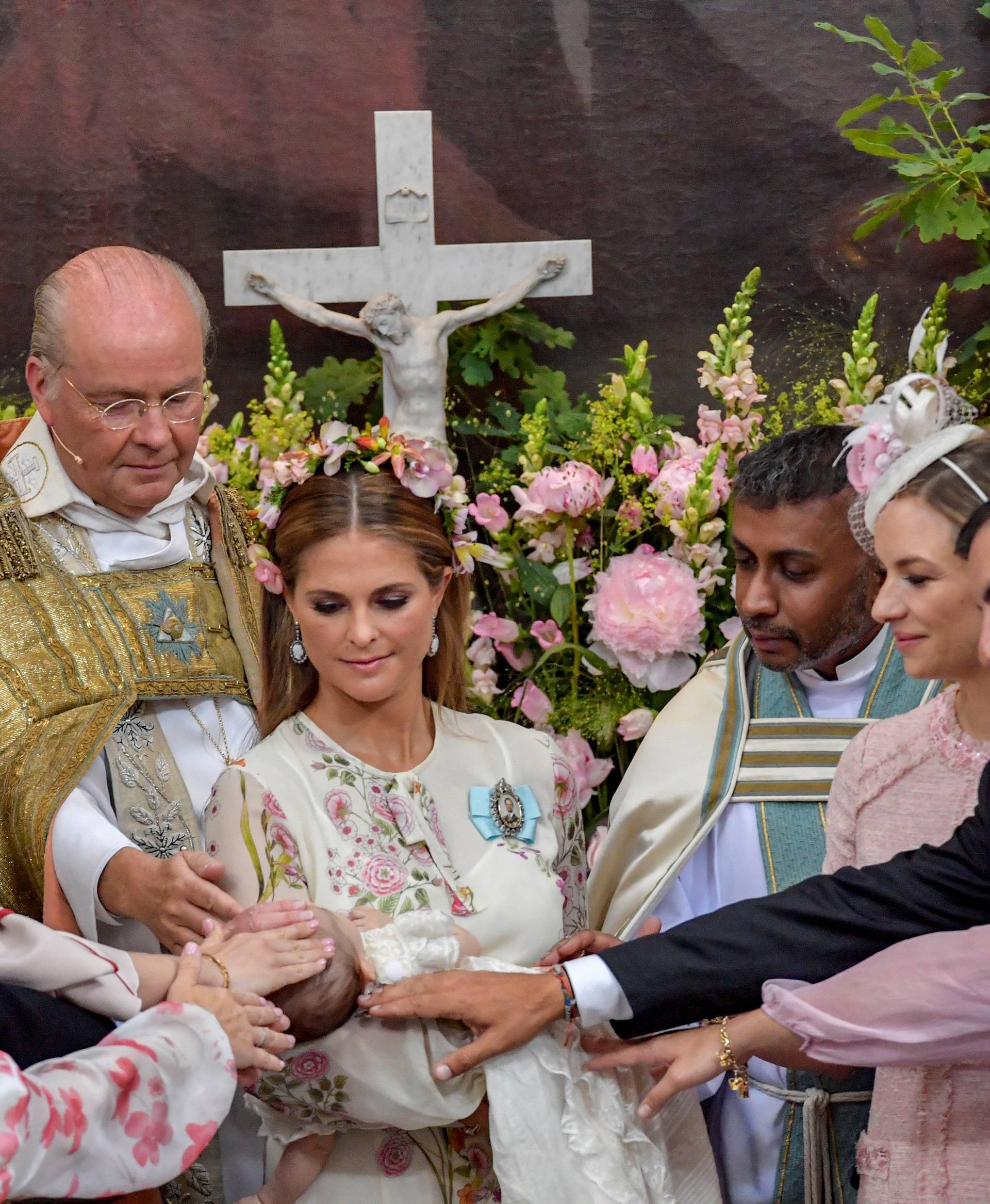 Princess Madeleine with Princess Adrienne are seen together during the christening ceremony  in Drottningholm Palace Chapel outside Stockholm