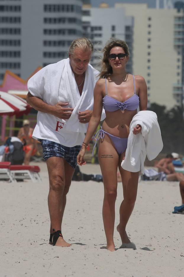 EXCLUSIVE: Dolph Lundgren, 67, is seen with his 29-year-old bikini-clad wife as they hit the beach in Miami