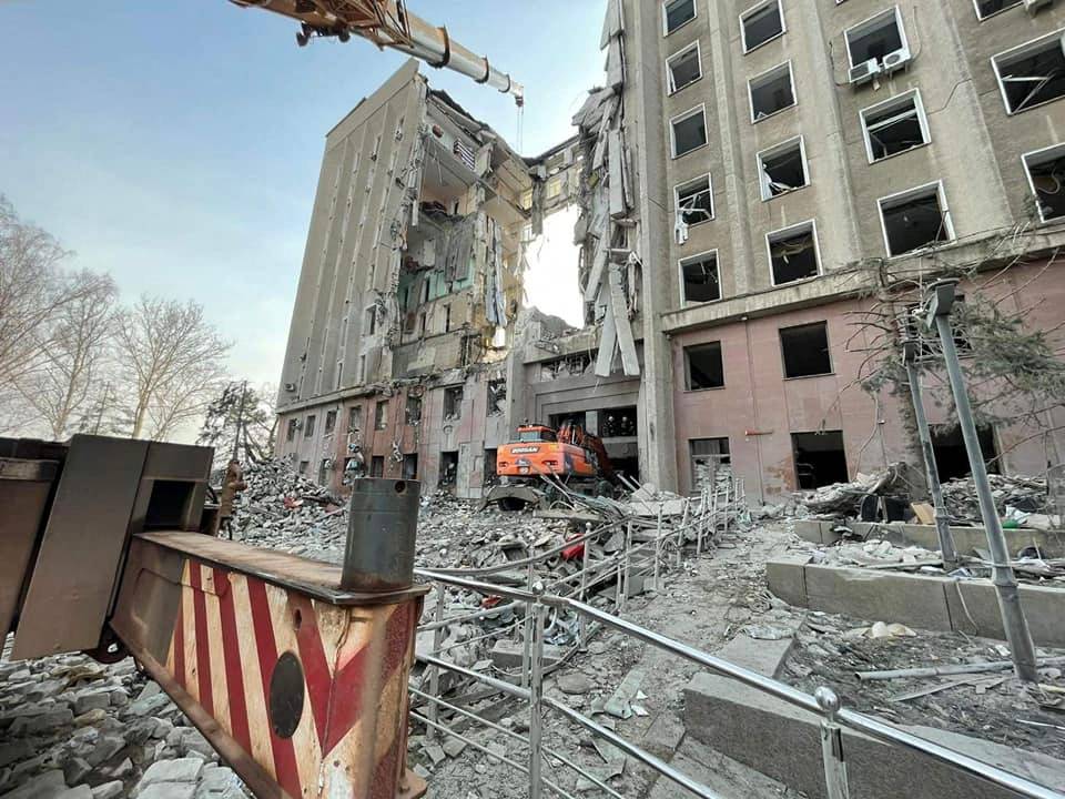 Rescuers work at the site of the regional administration building hit by cruise missiles, in Mykolaiv