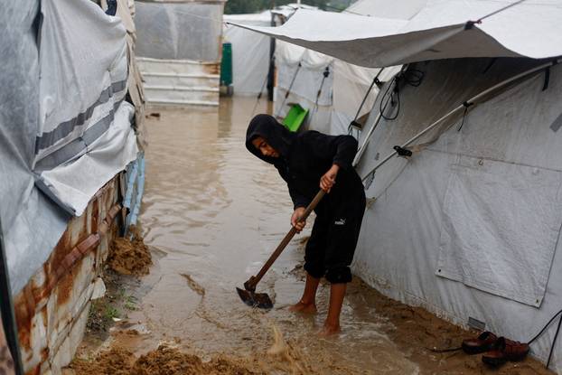 Displaced Palestinians shelter in a tent camp in Nuseirat