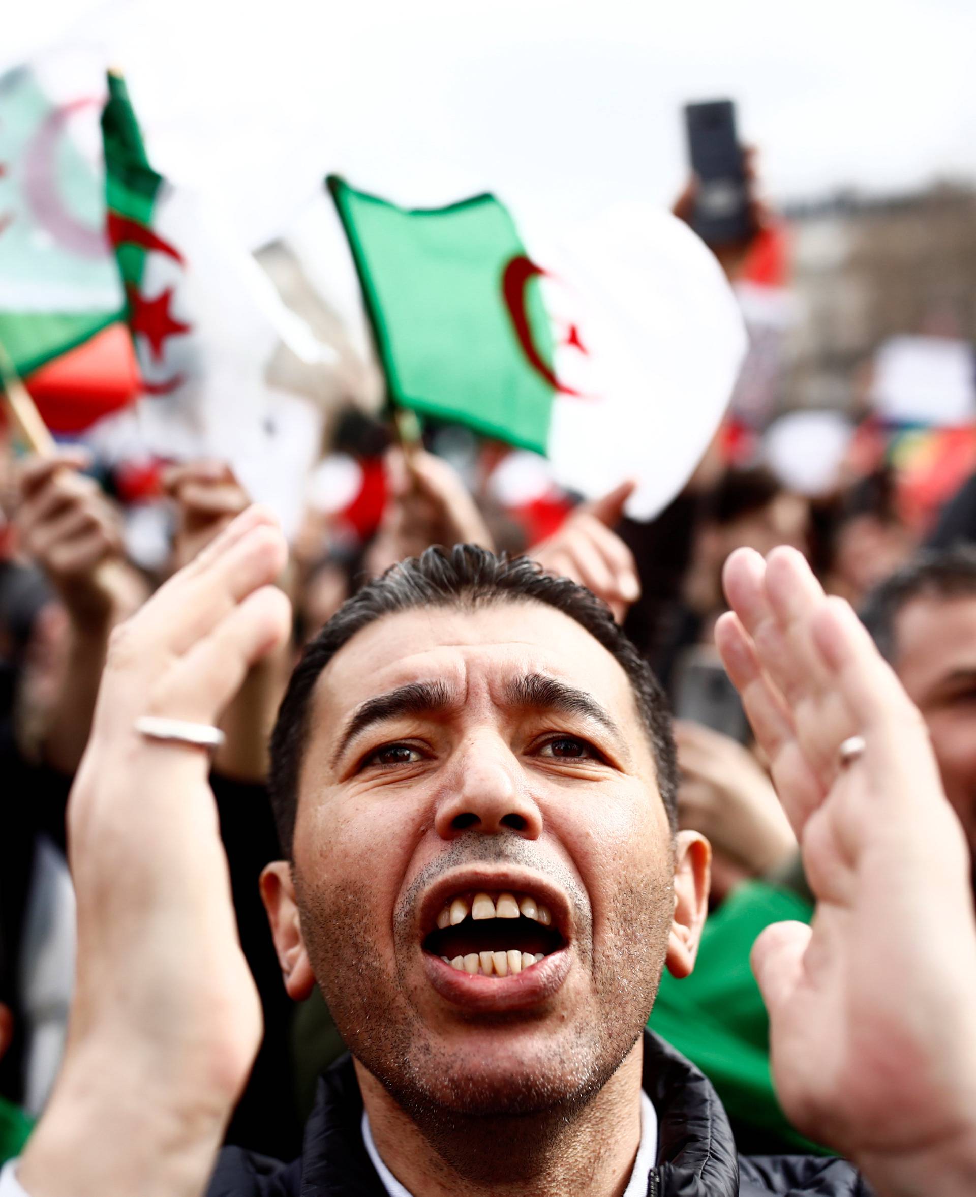 Demonstrators gather near the Monument to the Republic during a protest against Algerian President Abdelaziz Bouteflika seeking a fifth term in a presidential election in Paris