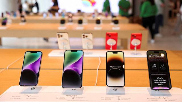 FILE PHOTO: Apple iPhones are seen inside India's first Apple retail store, a day ahead of its launch, in Mumbai