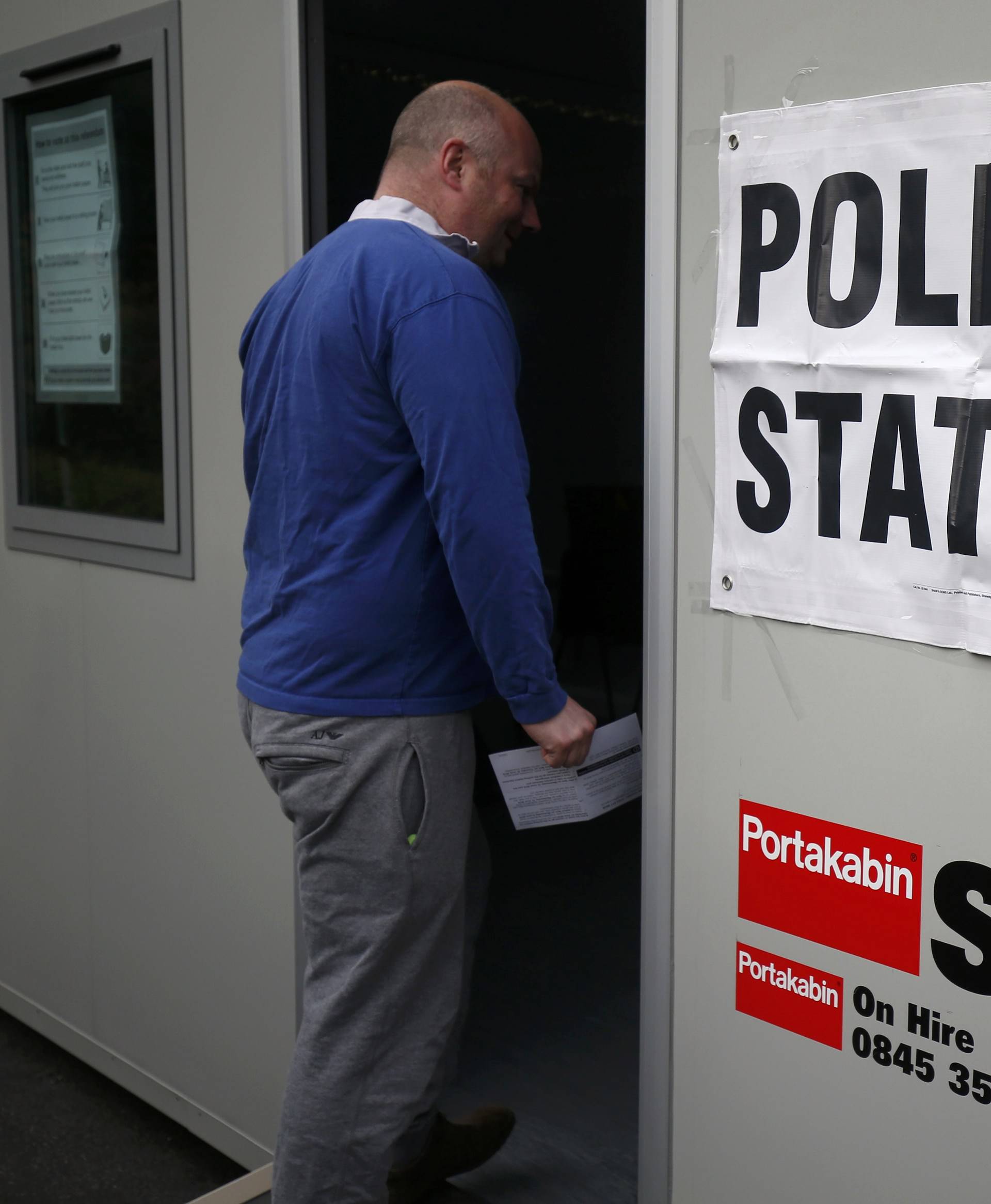 A man walks into a polling station for the Referendum on the European Union in Heald Green, Stockport, Britain
