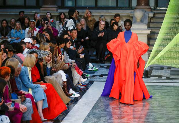 Models present creations during the Roksanda catwalk show at the Foreign & Commonwealth Office during London Fashion Week in London