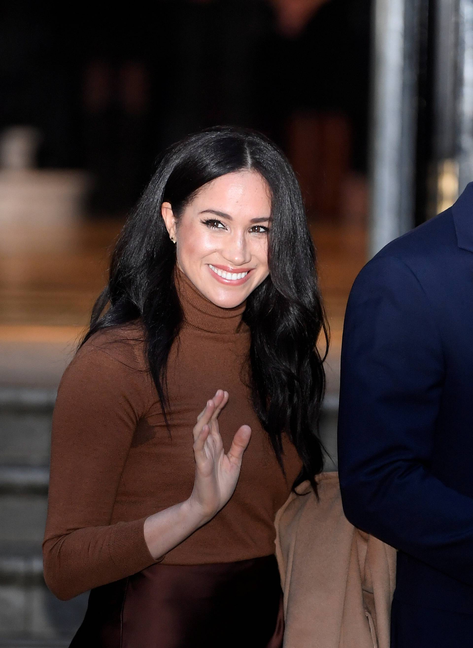 FILE PHOTO: Britain's Prince Harry and his wife Meghan, Duchess of Sussex, leave Canada House in London