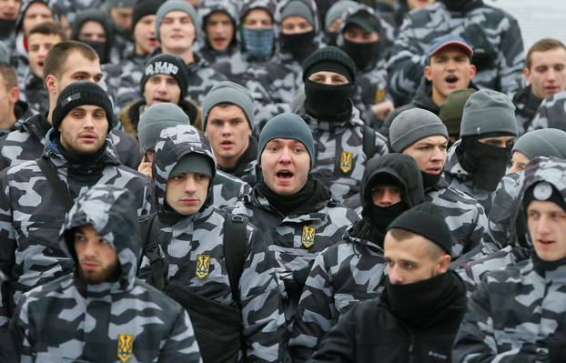 Activists of far-right parties attend a rally to support the Ukrainian navy after Russia seized two Ukrainian armored artillery vessels and a tug boat in the Black Sea on Sunday, in central Kiev