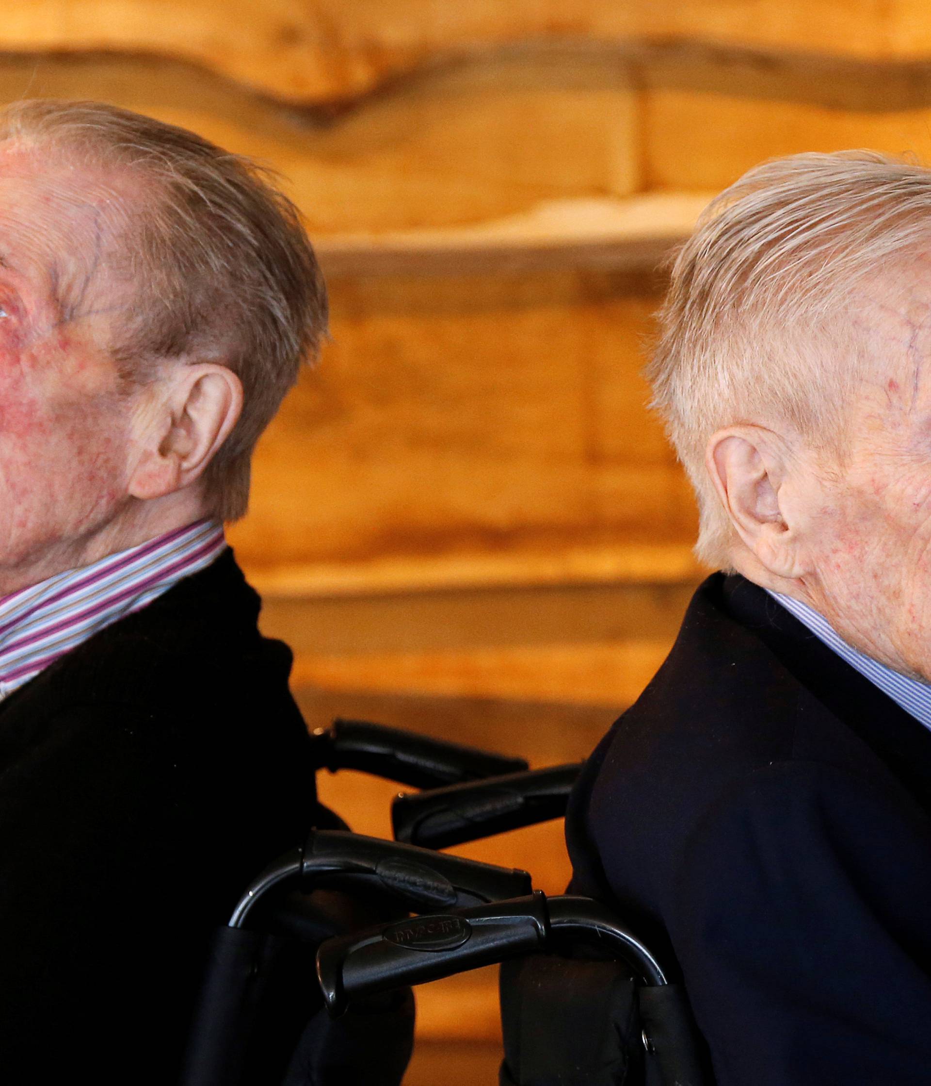 The world's oldest living twin brothers, Paulus and Pieter Langerock from Belgium, 102, pose at the Ter Venne retirement home in Sint-Martens-Latem