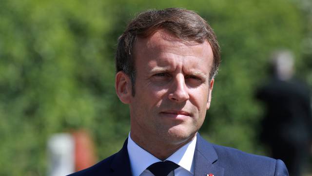 French President Emmanuel Macron visits a factory of manufacturer Valeo, in Etaples