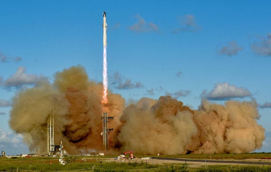 A SpaceX Super Heavy booster carrying the Starship spacecraft lifts off on its 11th test flight