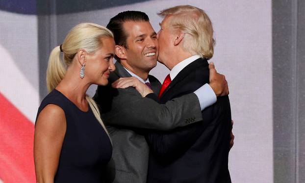 FILE PHOTO: Donald Trump Jr. hugs his father as his wife Vanessa walks past at 2016 Republican National Convention in Cleveland