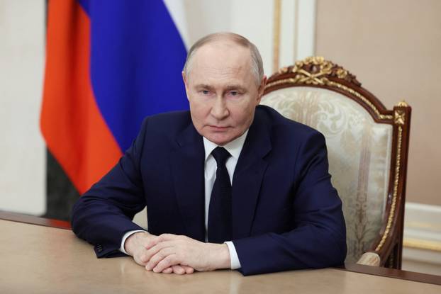 Russian President Vladimir Putin makes a video address on Defender of the Fatherland Day in Moscow