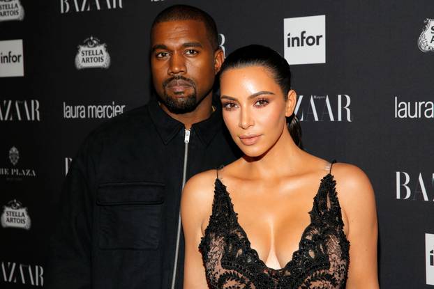 Kanye West and Kim Kardashian attend Harper