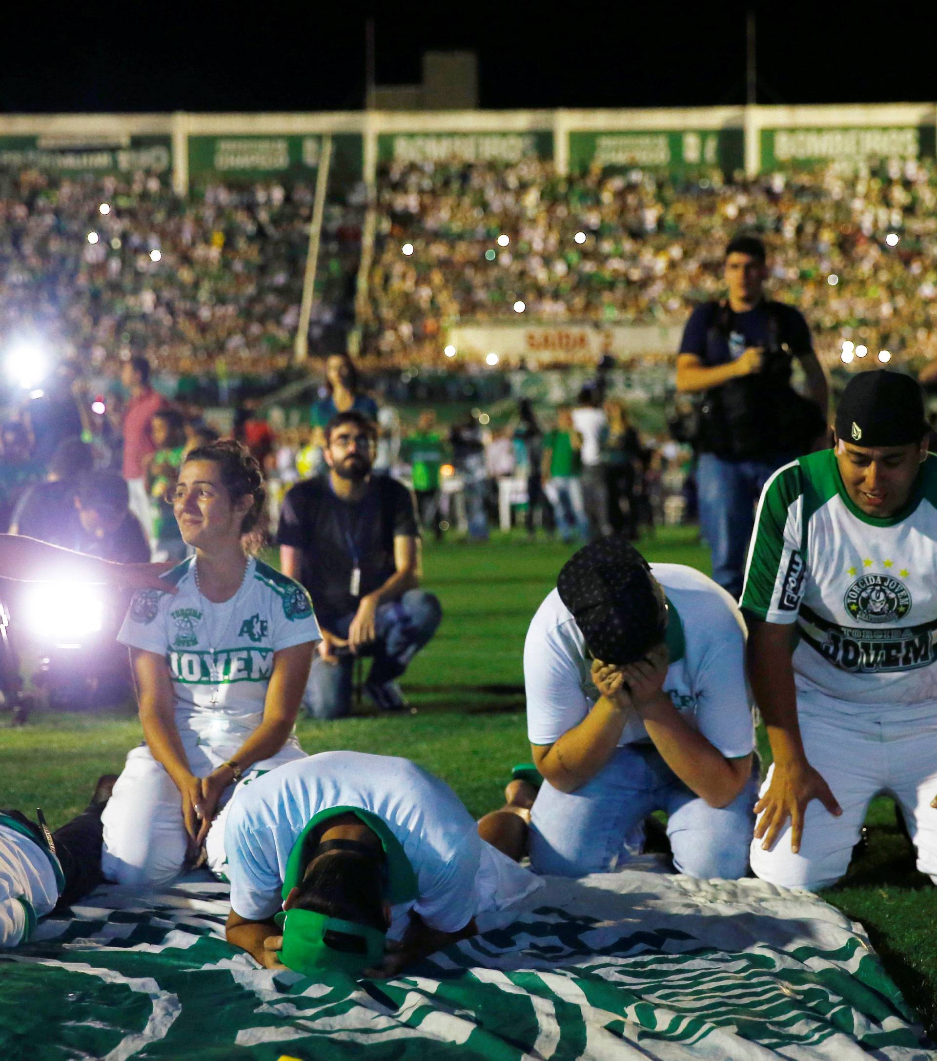 Fans of Chapecoense soccer team pay tribute to Chapecoense's players at the Arena Conda stadium in Chapeco