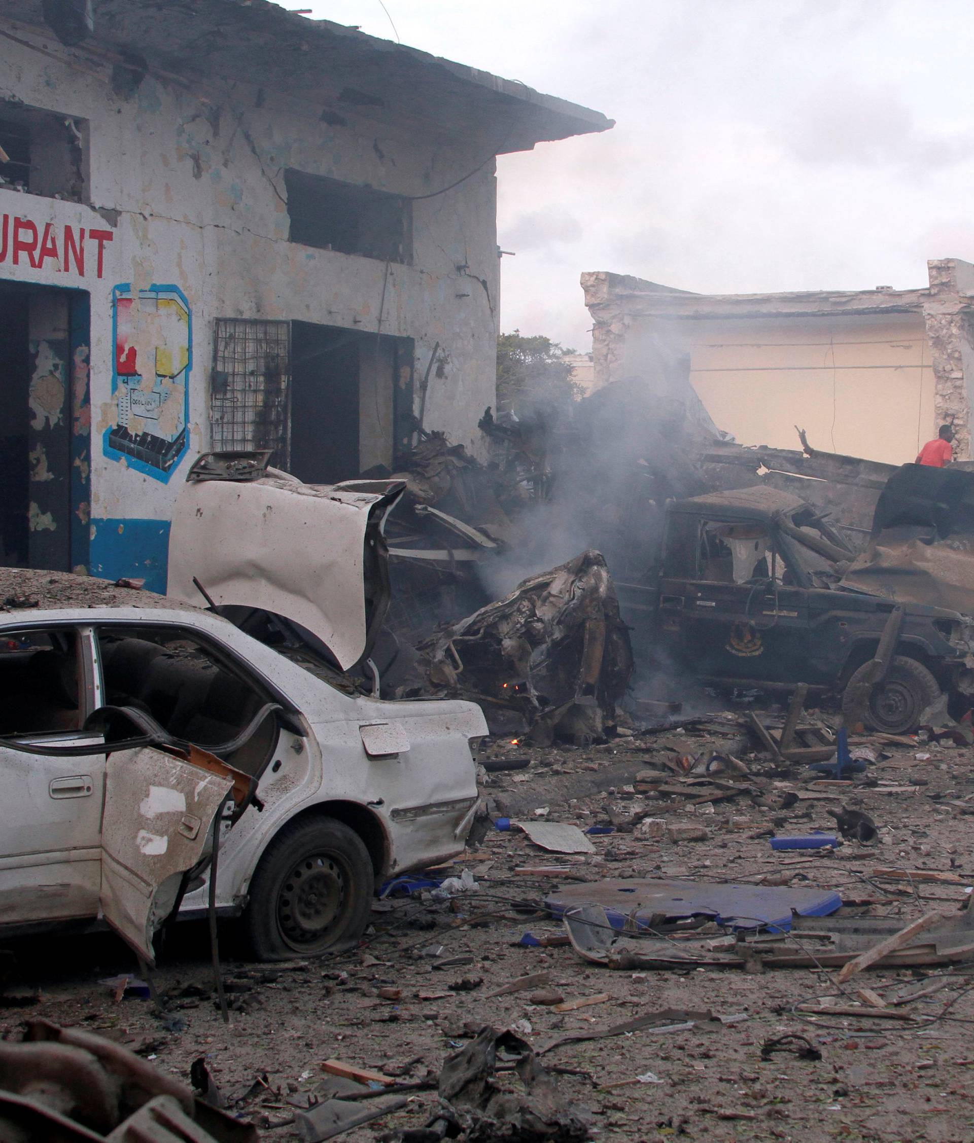 General view shows the aftermath of a suicide car bombing at the gate of Naso Hablod Two Hotel in Mogadishu