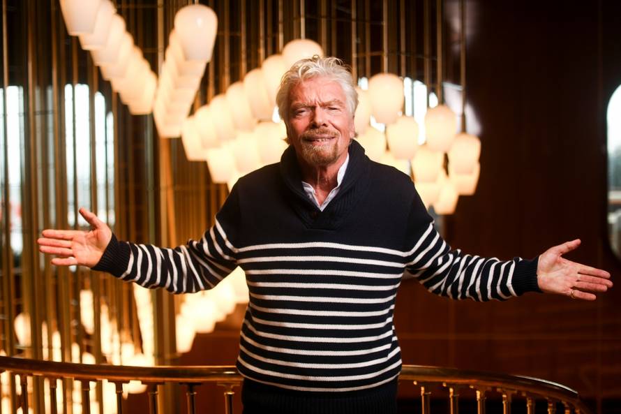 Richard Branson, founder of Virgin Group, poses for a photograph on board of his new cruise liner, the Scarlet Lady at Dover Port in Dover