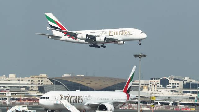 FILE PHOTO: Emirates Airlines Airbus A380 plane approaches for landing at Dubai Airports in Dubai