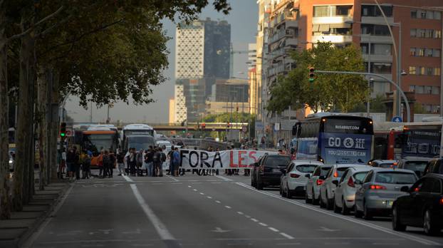 Picketers block Gran Via street during a general strike called by pro-independence parties and unions in Barcelona