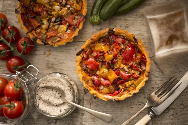 Tomato,And,Pepper,Tarts,On,A,Wooden,Tabletop