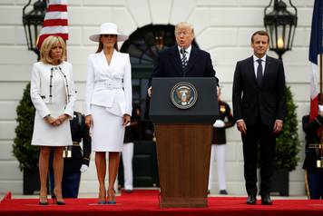 U.S. President Donald Trump and first lady Melania Trump welcome French President Emmanuel Macron and his wife Brigitte Macron during an arrival ceremony at the White House in Washington