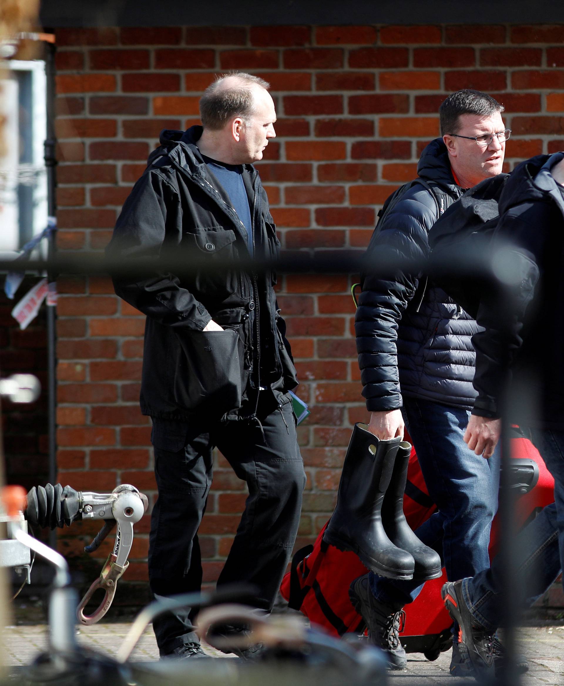 FILE PHOTO: Inspectors from the Organisation for the Prohibition of Chemical Weapons (OPCW) arrive to begin work at the scene of the nerve agent attack on former Russian spy Sergei Skripal, in Salisbury, Britain