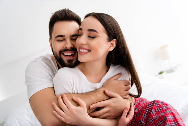 Photo of two people spouses have strong bonding feelings cuddle in house indoors