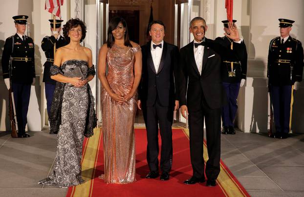 U.S. President Barack Obama and U.S. first lady Michelle Obama greet Italian Prime Minister Matteo Renzi and Agnese Landini at the White House in Washington.