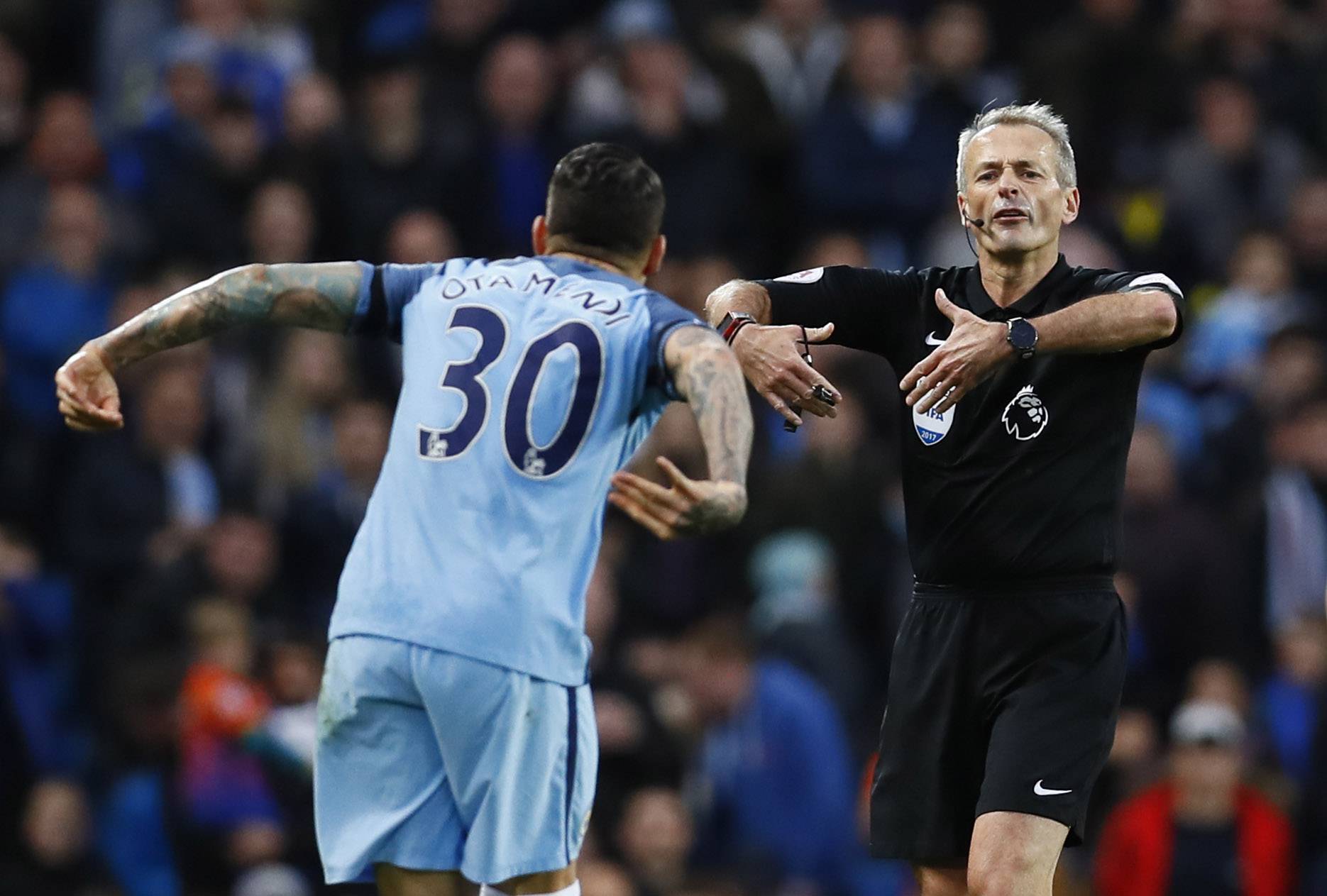 Manchester City's Nicolas Otamendi gestures to referee Martin Atkinson