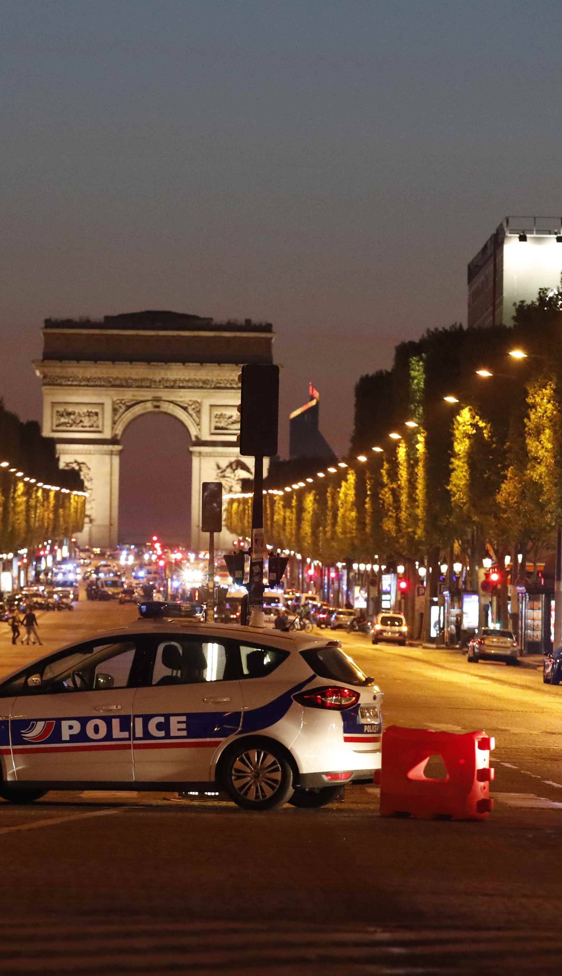 Police secure the Champs Elysee Avenue after one policeman was killed and another wounded in a shooting incident in Paris