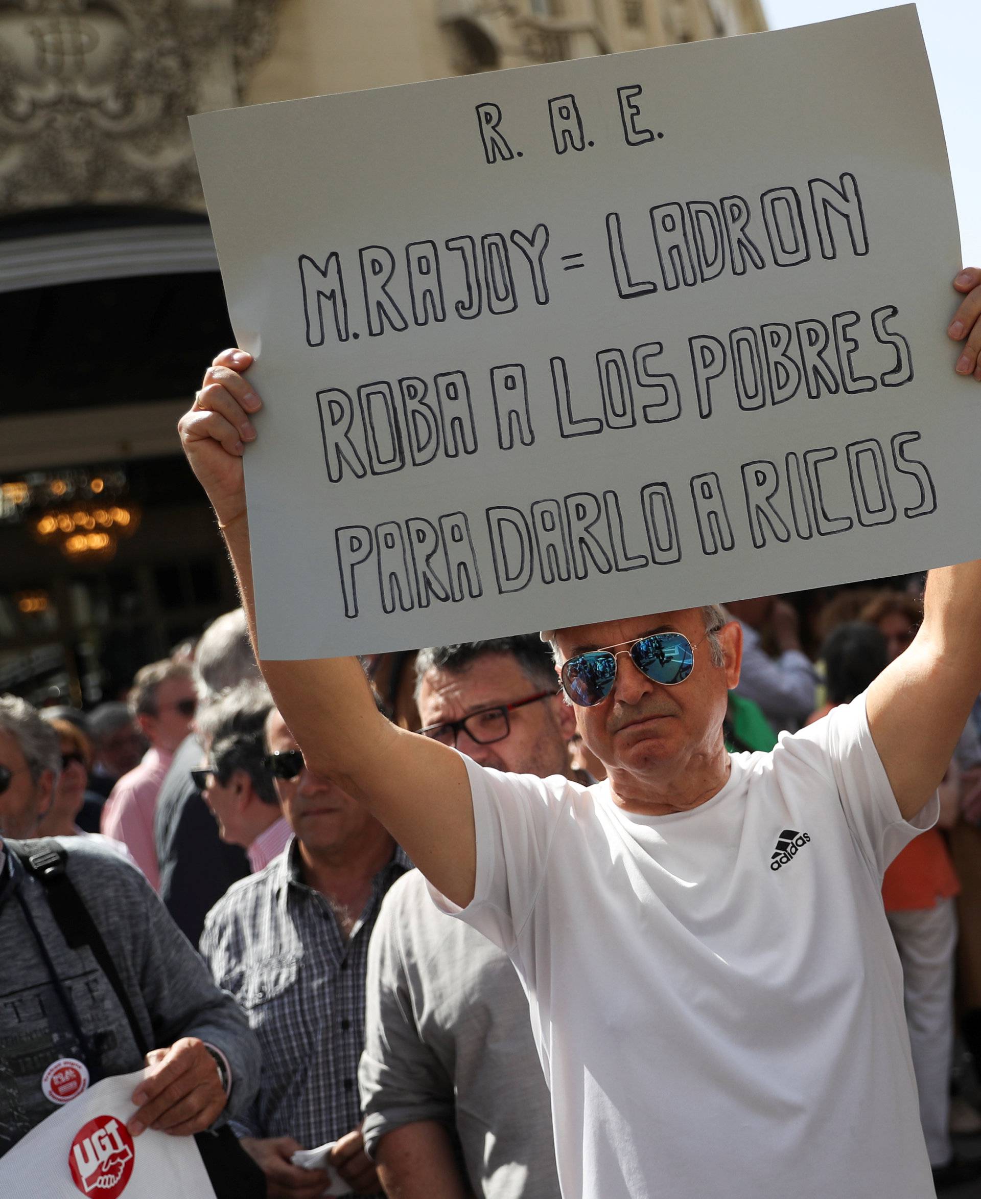 Pensioners protest outside parliament as the budget debate finishes inside, in Madrid