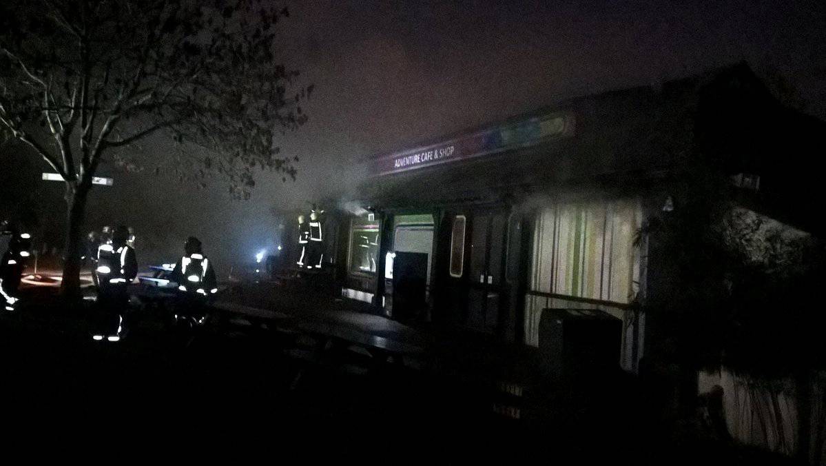 Firefighters are seen tackling a blaze at London Zoo following a fire which broke out at a shop and cafe at the attraction, in central London