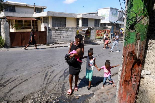 Haitians flee homes due to gang violence, in Port-au-Prince