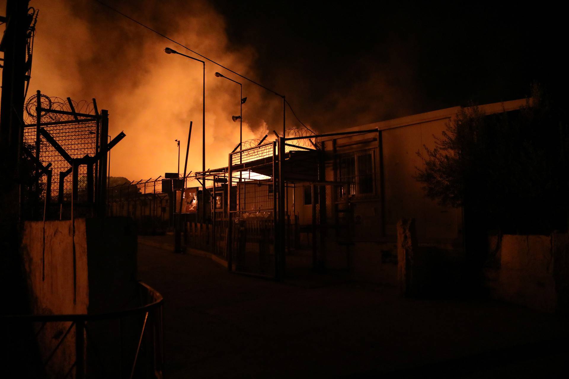 Flames rise as a fire burns at the Moria camp for refugees and migrants on the island of Lesbos