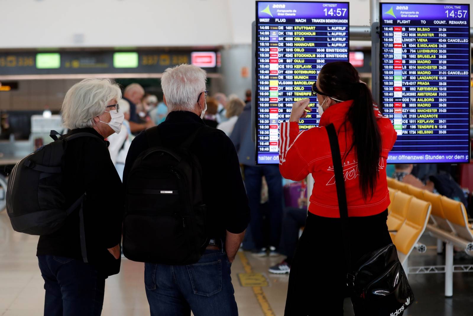 Tourists at Gran Canaria airport return to their countries after closure of hotels during health emergency of coronavirus disease (COVID-19)