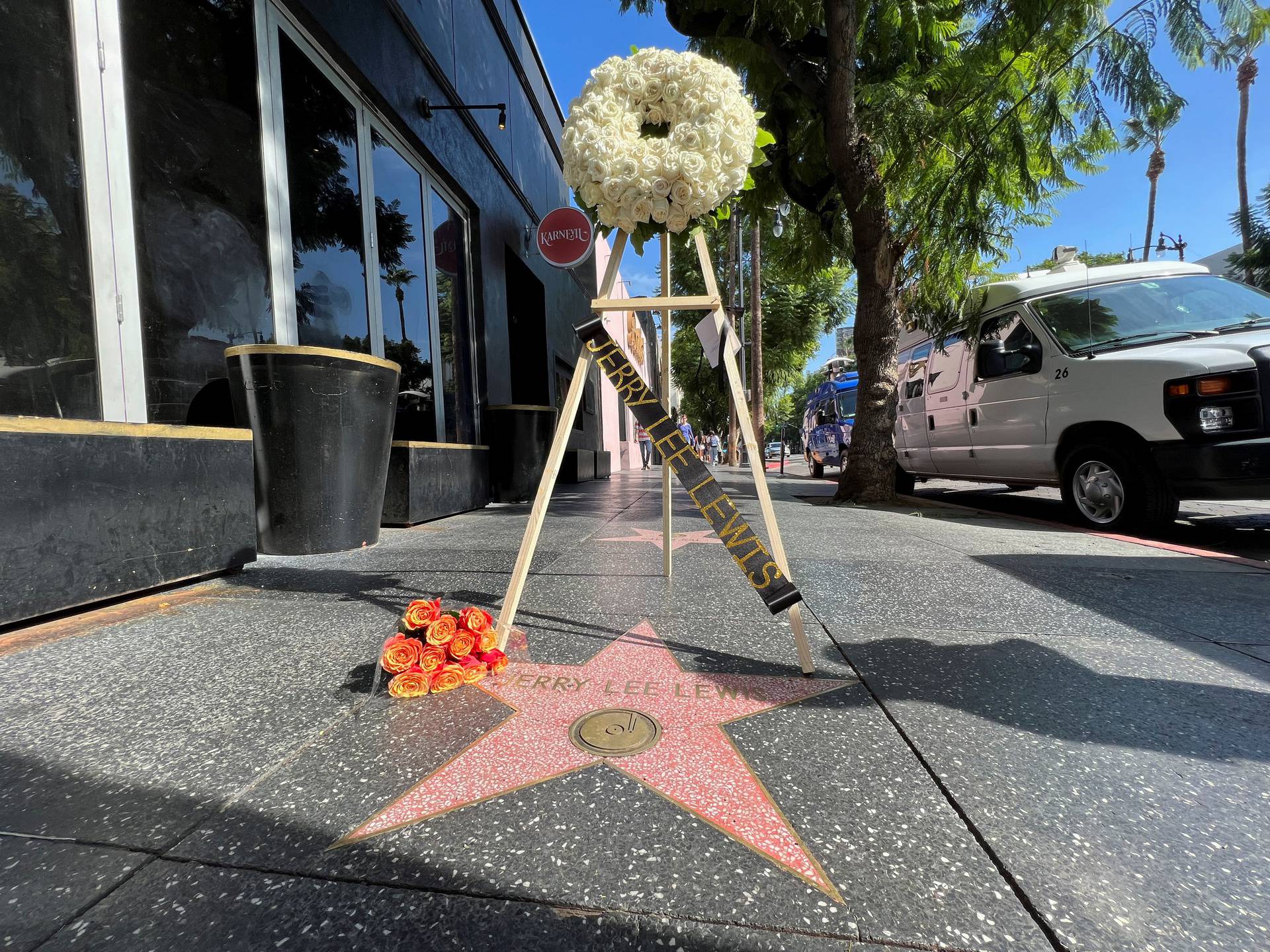 Flowers being laid at Jerry Lee Lewis' star in Hollywood