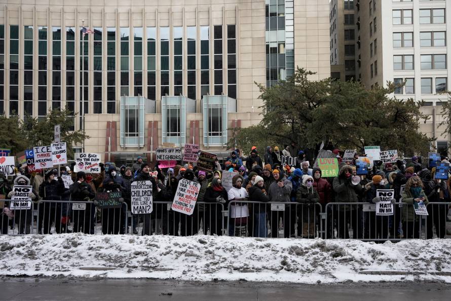 People attend the "March Against Minnesota Fraud" in Minneapolis