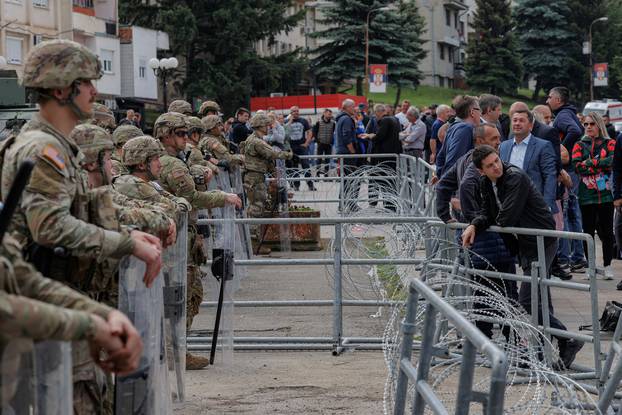 Hungarian KFOR soldiers protect the entrance of the municipality office, in the town of Zvecan
