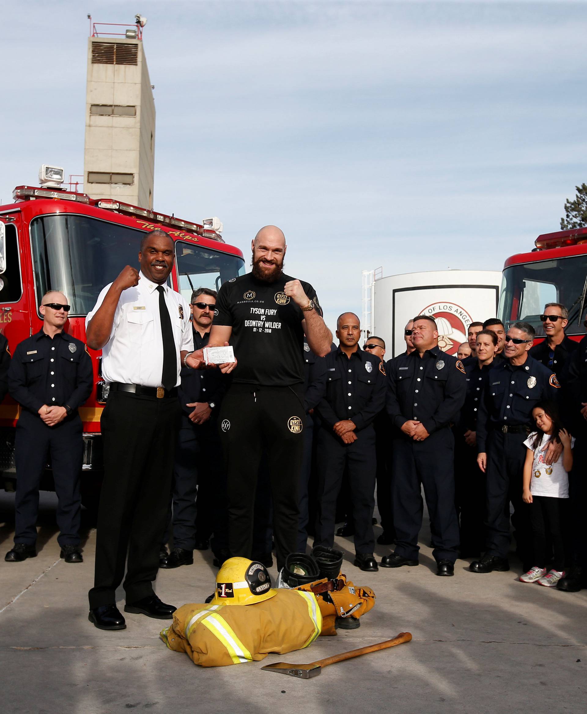 Tyson Fury presents tickets to LA firefighters ahead of his WBC heavyweight title fight with Deontay Wilder